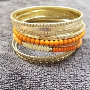 Gold and orange bangles